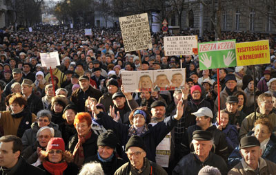 Hungarians demonstrate against the government's media law during a protest in support of the largest opposition radio station in Budapest Sunday. (AP Photo/Bela Szandelszky)