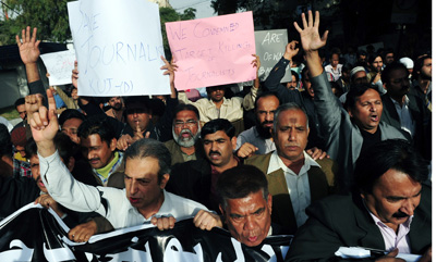 Pakistani journalists protest the death of Wali Khan Babar, killed one year ago today. (AFP/Asif Hassan)