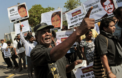 Sri Lankan journalists stage the "Black January" protest, demanding the government punish the culprits responsible for killing journalists. (AP/Eranga Jayawardena)