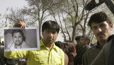 At a demonstration in Kabul, a photo of the slain Afghan journalist Ajmal Naqshbandi. (AP/Musadeq Sadeq)