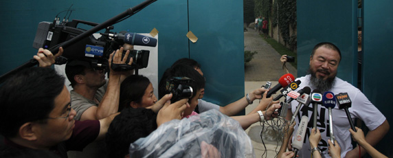 Ai Weiwei speaks to journalists at his home in Beijing after the government held him incommunicado for nearly three months. (AP/Ng Han Guan)