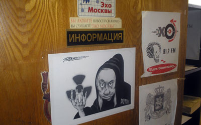 A poster depicts Vladimir Putin as the Grim Reaper on one of Ekho Moskvy's studio doors. (CPJ/Nina Ognianova)