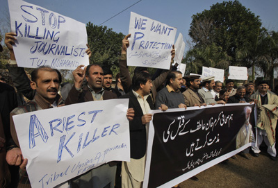 Pakistani journalists protest the killing of Mukarram Khan Aatif in Peshawar. (AP/Mohammad Sajjad)