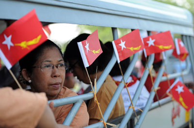 Supporters of Burma opposition leader Aung San Suu Kyi's party travel to a rally at a Yangon constituency on Friday. (AFP/Soe Than Win)