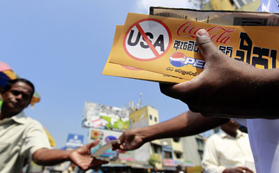 Sri Lankans are calling for a boycott of U.S. products after the U.S. sponsored the U.N. Human Rights Council resolution calling for an investigation into possible war crimes. (Reuters/Dinuka Liyanawatte)