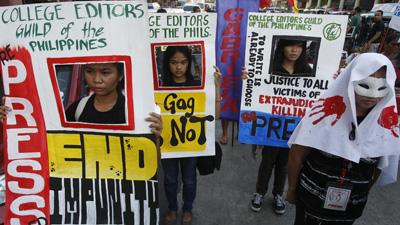 Two men attempted to kill a radio journalist on Friday. Here, reporters and students protest the high number of unsolved journalist murders across the Philippines. (AP/Bullit Marquez)