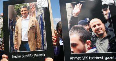 Journalists Nedim Şener and Ahmet Şık were threatened shortly after their release from prison. Here, colleagues protest the journalists' imprisonment, which lasted more than a year. (AP)