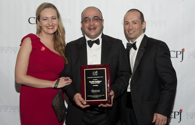 Eynulla Fatullayev, center, is pictured with CPJ's Europe and Central Asia program coordinator, Nina Ognianova, and research associate Muzaffar Suleymanov at the 2011 International Press Freedom Awards in New York. (CPJ)