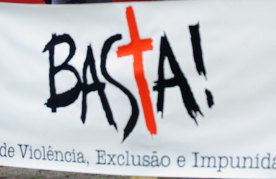 At a protest against the murder of a journalist in Sao Paulo, Brazil, a sign reads: "Enough of violence, exclusion and impunity." (AP/Dario Lopez-Mills)