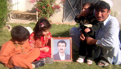 Journalist Hayatullah Khan, shown in the picture above surrounded by his family, was killed in 2006. (AP/Abdullah Noor)