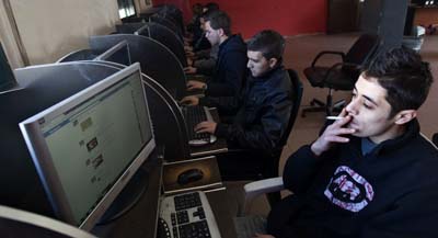 The Palestinian Authority has blocked at least eight websites from Internet users in the West Bank. Here, Palestinian youths go online at an Internet cafe. (AFP/Ahmad Gharabli)