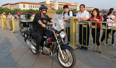 A police officer patrols as part of heavy security at Tiananmen Square in Beijing. (AFP/Mark Ralston)