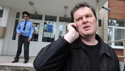 Andrzej Poczobut, seen here outside a courthouse in 2011, has been arrested and charged with libel. (AFP/Kseniya Avimova)