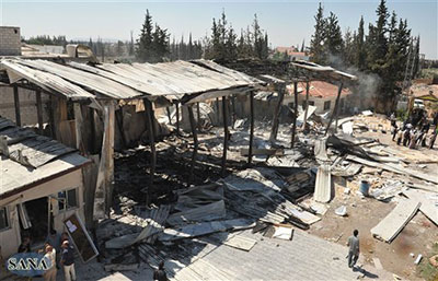 Gunmen attacked Al-Ikhbariya TV this morning, destroying the offices and killing staff members, according to state media. (AP/SANA)