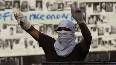 A protester in Jidhafs, Bahrain. (AP/Hasan Jamali)