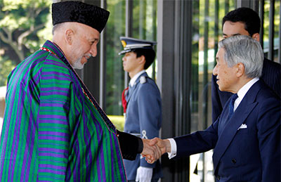 Afghan President Hamid Karzai, left, is welcomed by Japan's Emperor Akihito in Tokyo in 2010. Japan is one of Afghanistan's biggest donors. (AP/Koji Sasahara)