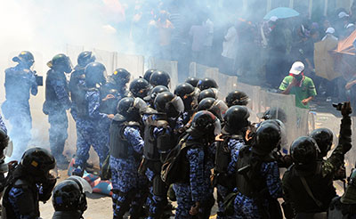 Maldivian riot police clash with supporters of ousted President Mohamed Nasheed in Male in March. (AFP)