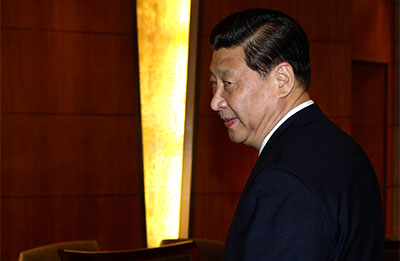 Xi Jinping's youth is the subject of an article that may be related to a newspaper editor's reassignment. Xi is expected to be China's next president. (AP/Jason Lee)