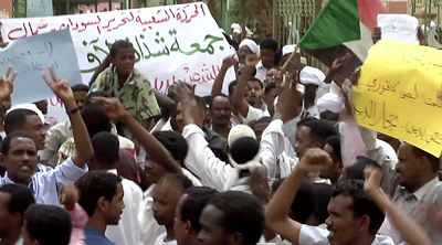 A screen shot from AFP TV shows Sudanese demonstrators protesting in Khartoum on Friday. (AFP)