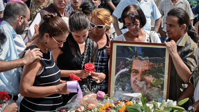 Hundreds attended the funeral of Oswaldo Payá, a Cuban activist, on Monday. (AFP/Adalberto Roque)