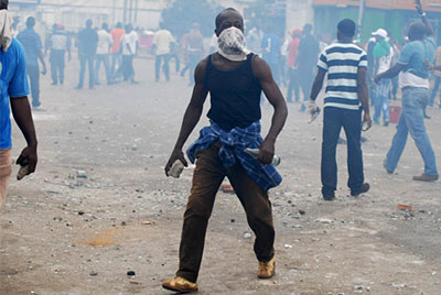 Clashes broke out in Gabon's capital Libreville on Wednesday when police broke up a protest in support of the country's main opposition leader. (AFP/Xavier Bourgois)