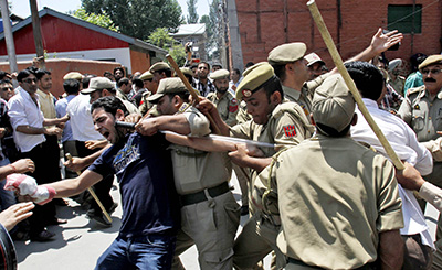 Indian police detain a Kashmiri protester in Srinagar. (AP/Mukhtar Khan)