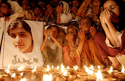 Pakistani children in Karachi pray for the recovery of 14-year-old schoolgirl Malala Yousafzai, who was shot by the Taliban, on October 12. (AP/Shakil Adil)