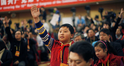 Eleven-year-old Zhang Jiahe asks a question during the 18th National Party Congress (NPC) in Beijing. (Reuters/Carlos Barria)