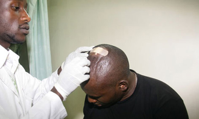 John Otanga seeks treatment for his head injury at a local hospital. (Nation/Billy Mutai)