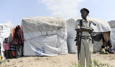 A police officer guards a camp of internally displaced persons in Mogadishu. (AFP/Tony Karumba)