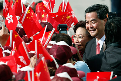 Hong Kong Chief Executive Leung Chun-ying and his wife attend a ceremony to mark the 15th anniversary of Hong Kong's handover to China on July 1, 2012. (AP/Kin Cheung)