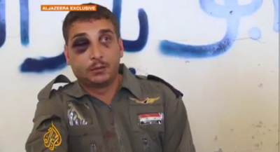 A Syrian pilot shot down and taken prisoner is interviewed by Al-Jazeera on October 17. (YouTube)