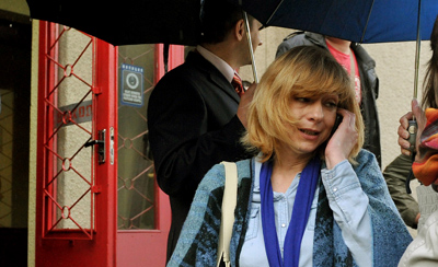 Irina Khalip speaks on her phone outside a Minsk courthouse in May 2011. (AFP/Viktor Drachev)