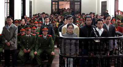 Vietnamese activists and bloggers stand for sentencing in court. (AFP/Vietnam News Agency)