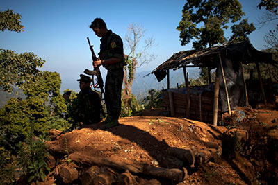 Kachin Independence Army soldiers guard an outpost in Northern Burma's Kachin-controlled region on January 31. Journalists who cover the conflict have been subject to email hacking attacks. (AP/Alexander F. Yuan)