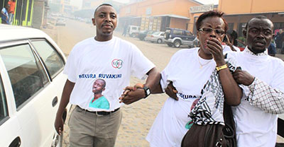 Burundi journalists react to tear gas at Tuesday's protest. (Teddy Mazina)