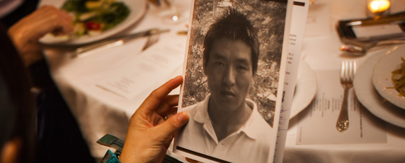 Lhamo Tso, Dhondup Wangchen's wife, holds his picture at CPJ's awards ceremony. (AFP/Michael Nagle)