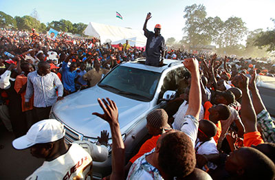 Kenyan Prime Minister and presidential candidate Raila Odinga waves to supporters at a campaign rally in Mombasa on Sunday. (Reuters/Joseph Okanga)