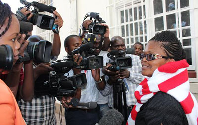 Reporters surround Beatrice Mtetwa as she exited a courthouse today. (ZLHR/Kumbirai Mafunda)