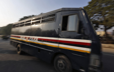 A police van takes defendants in the rape trial to court. (Reuters/Adnan Abidi)