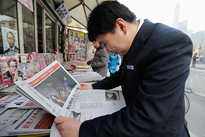 A man reads the Southern Weekly cover story at a newsstand in Beijing on January 10. (Reuters/Jason Lee)