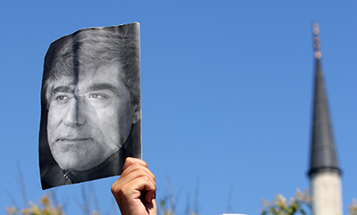 A protester holds up a photo of Turkish-Armenian editor Hrant Dink in Istanbul. (AFP/Bulent Kilic)