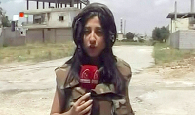 A screen grab from Syrian state TV shows Yara Abbas reporting from the city of Al-Qusayr. (AFP/Syrian TV)