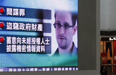 In a Hong Kong mall, a television monitor shows Snowden. (Reuters/Bobby Yip)