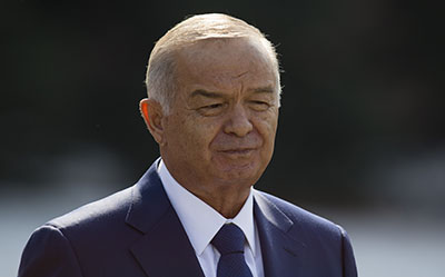 President Islam Karimov pledges to address the concerns of Uzbek journalists. (AP/Alexander Zemlianichenko)