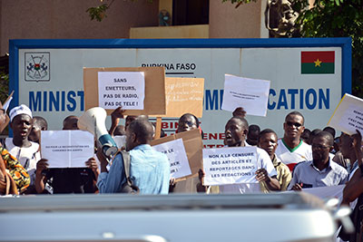 Journalists working for state media protest Tuesday in front of the Communications Ministry in Ouagadougou against authorities' meddling in their work. (AFP/Ahmed Ouoba)