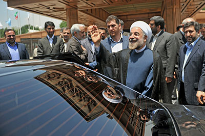 Hassan Rouhani leaves a conference in Tehran on June 29. Iran's president-elect called his win in national elections this month a vote for change. (AP/Office of the President-elect)