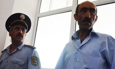Editor Sardar Alibeili, right, has been sentenced to four years in prison. (IRFS)