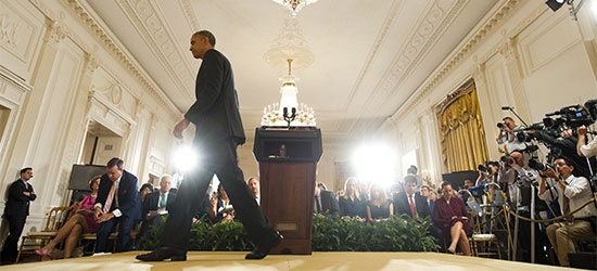 Barack Obama leaves a press conference in the East Room of the White House August 9. (AFP/Saul Loeb)