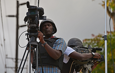 Kenyan journalists film outside the Westgate mall in September. (AFP/Carl de Souza)
